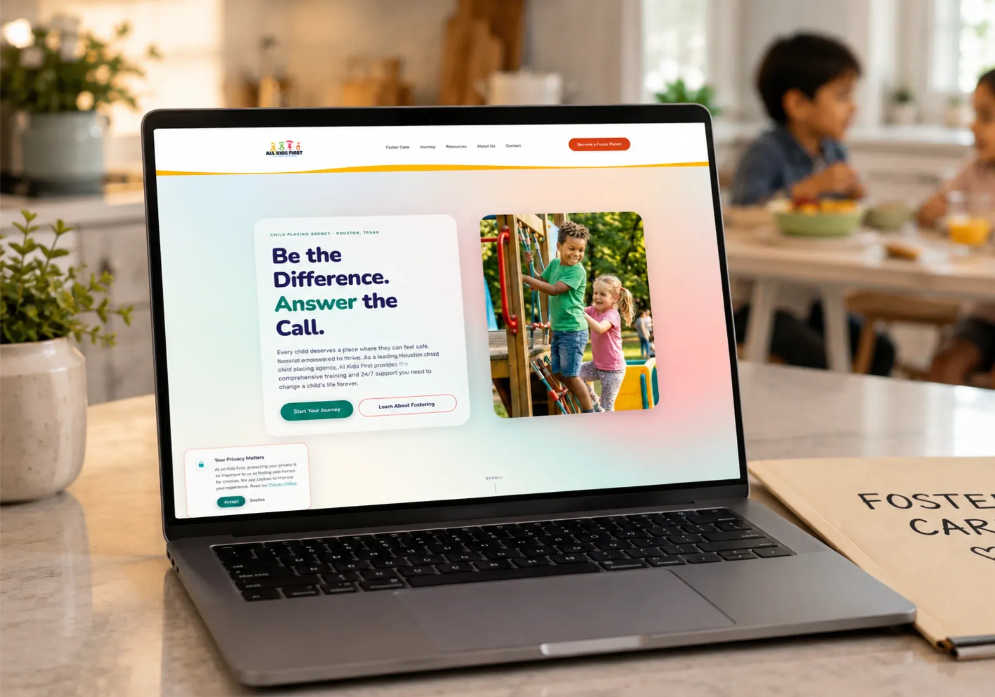 The All Kids First website on a laptop, with the headline “Be the Difference. Answer the Call.”