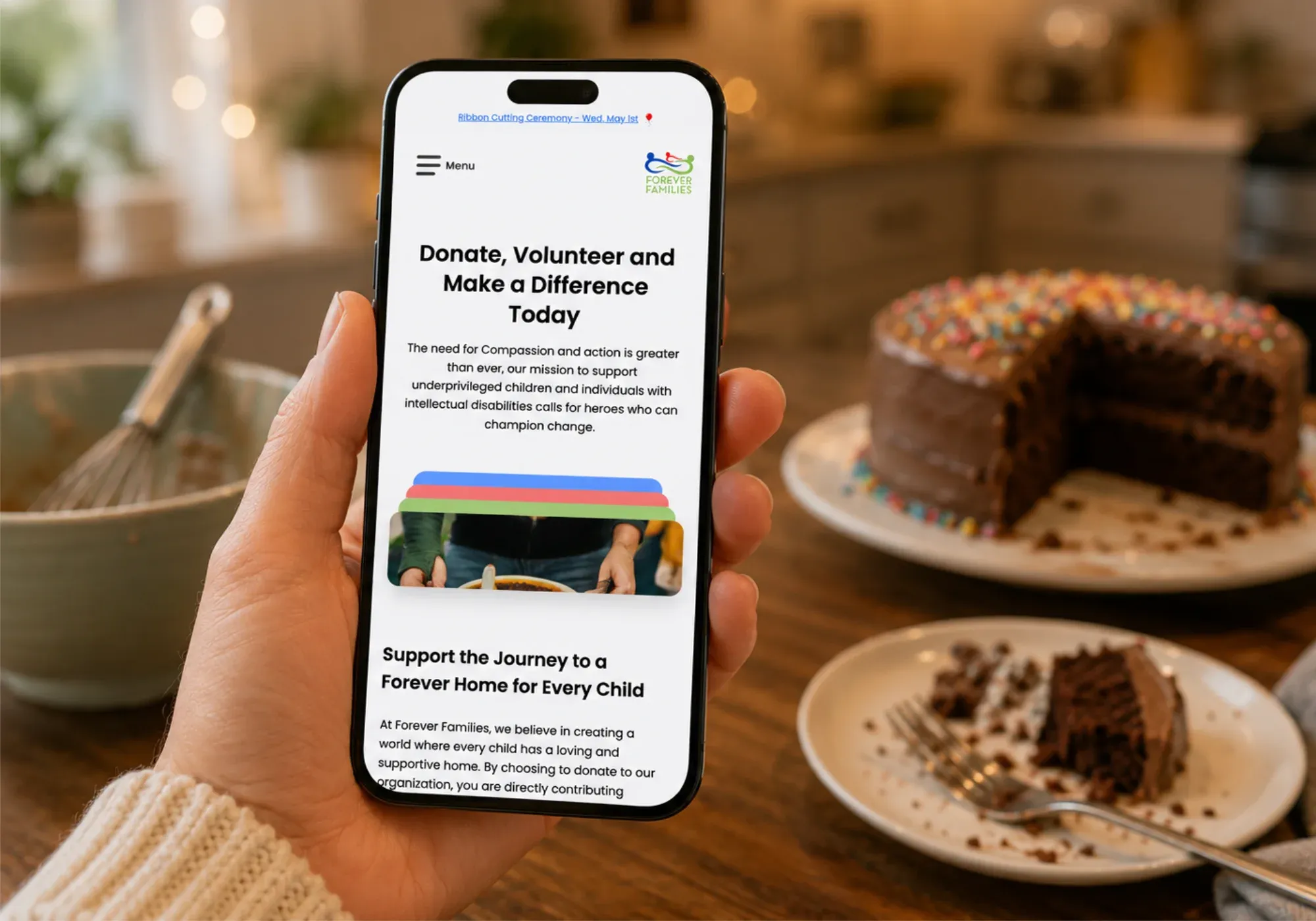 The Forever Families website on a mobile phone, encouraging visitors to donate and volunteer