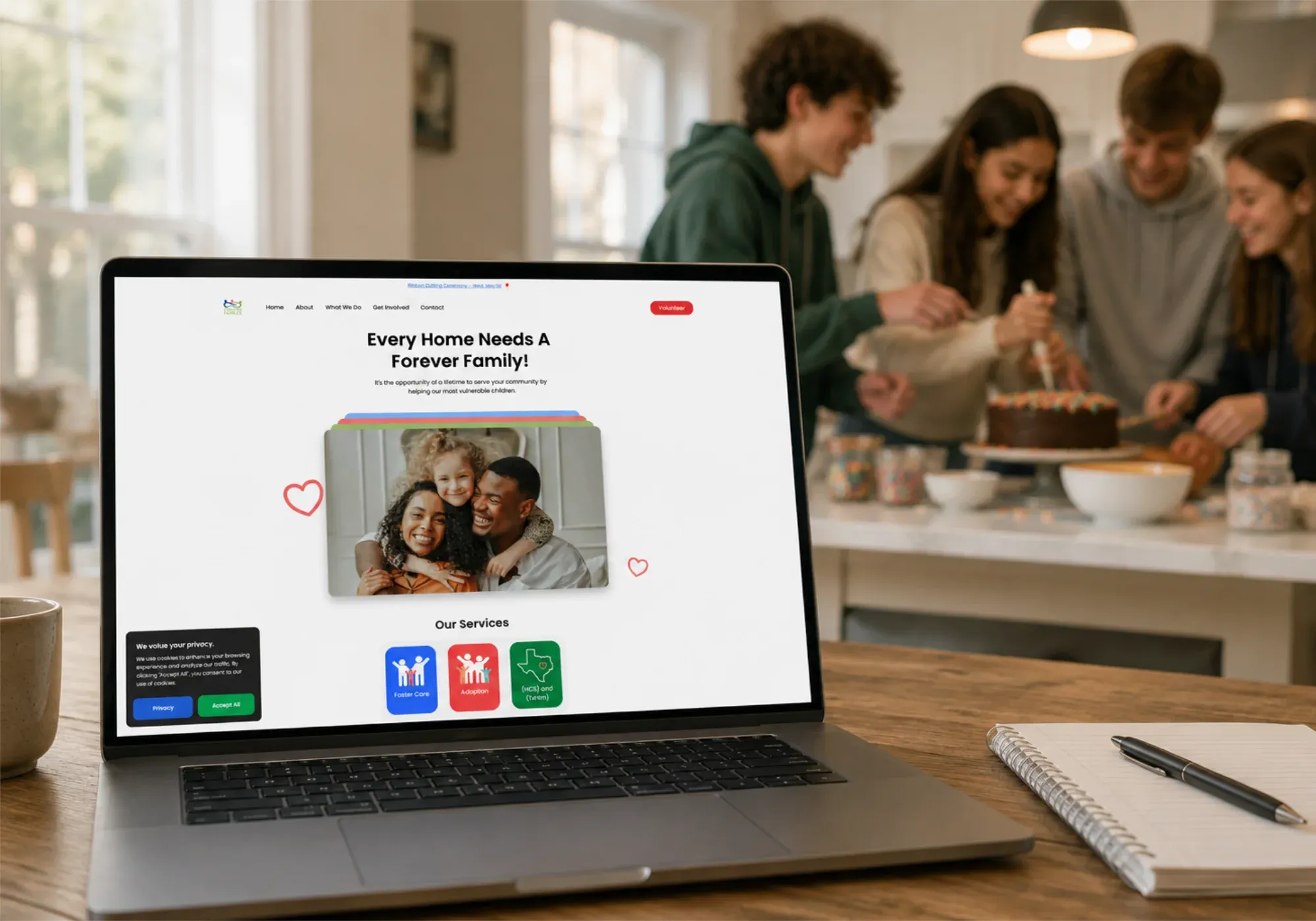 The Forever Families website on a laptop, with the headline “Every Home Needs A Forever Family!” and its service cards
