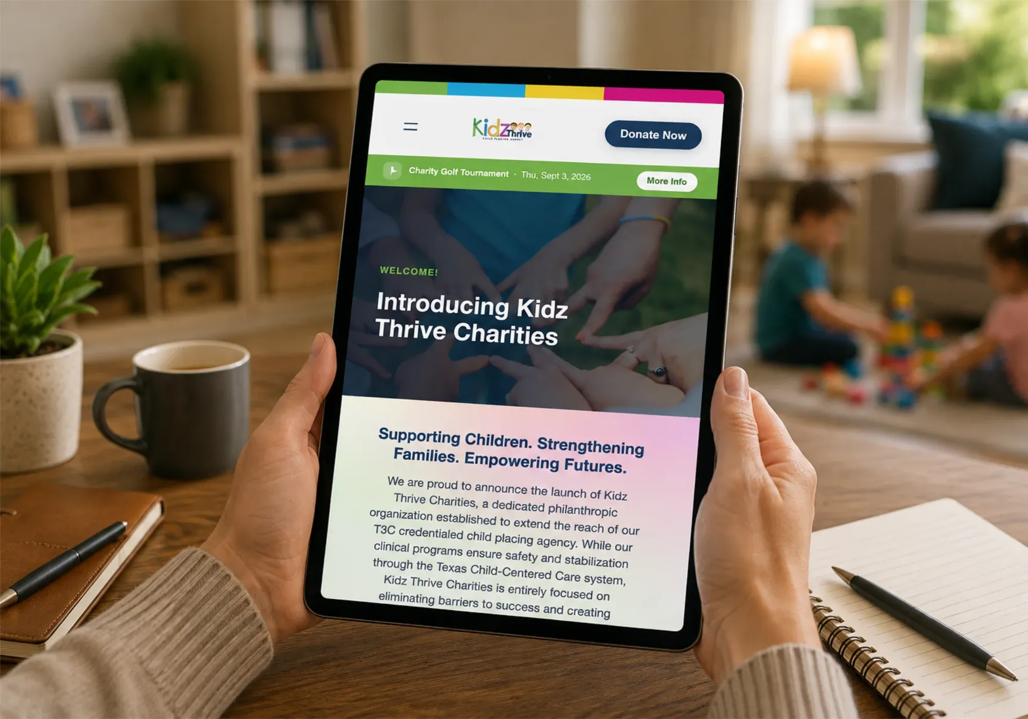The Kidz Thrive website on a tablet, introducing Kidz Thrive Charities
