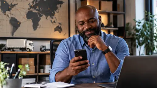 Logistics manager on the phone in his office.